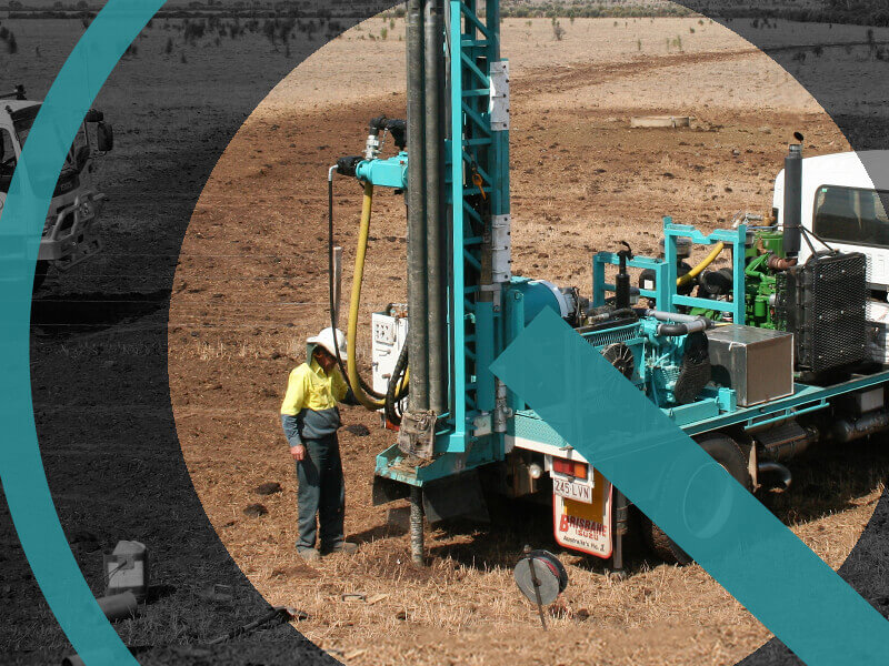 Employee & deep drilling truck at work